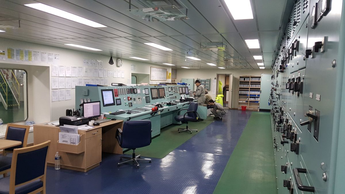 Engine control room with engineers at the console
